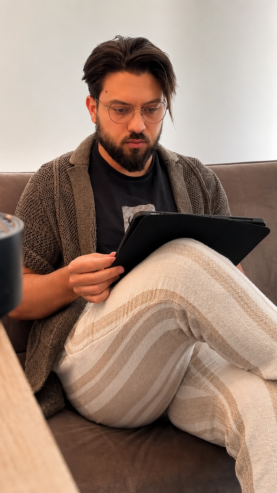 Kevin sketching a custom tattoo design on a tablet